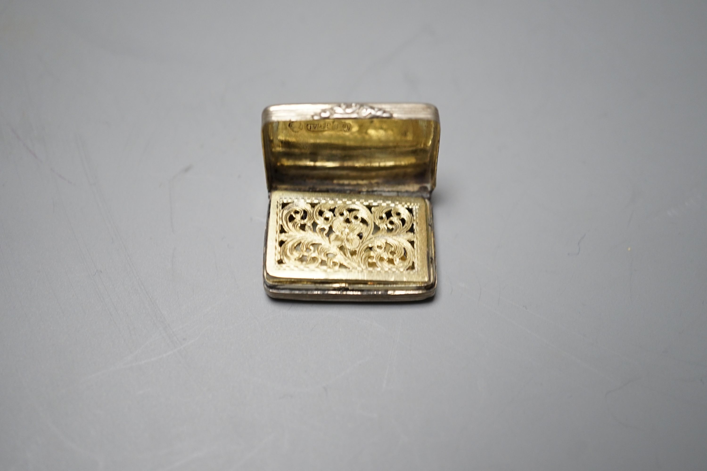 A William IV engraved silver rectangular vinaigrette, Taylor & Perry, Birmingham, 1831, 27mm.